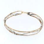 Handmade stamped brass skinny bracelet braided with oxidized sterling silver and gold filled wires