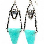A pair of mini darkened diamonds with fresh water pearls with oxidized sterling silver dot chain holding a  a bright turquoise triangular gemstone earring