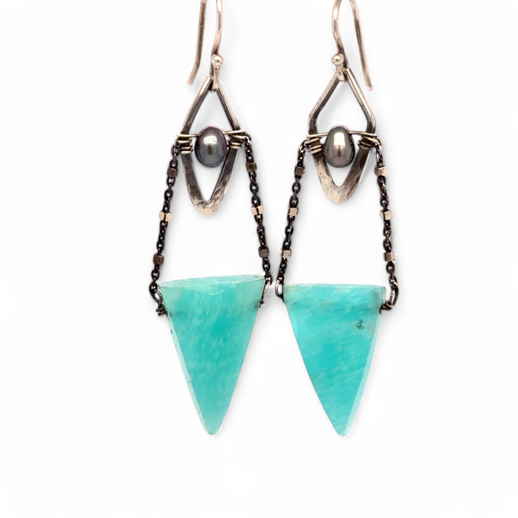 A pair of mini darkened diamonds with fresh water pearls with oxidized sterling silver dot chain holding a  a bright turquoise triangular gemstone earring