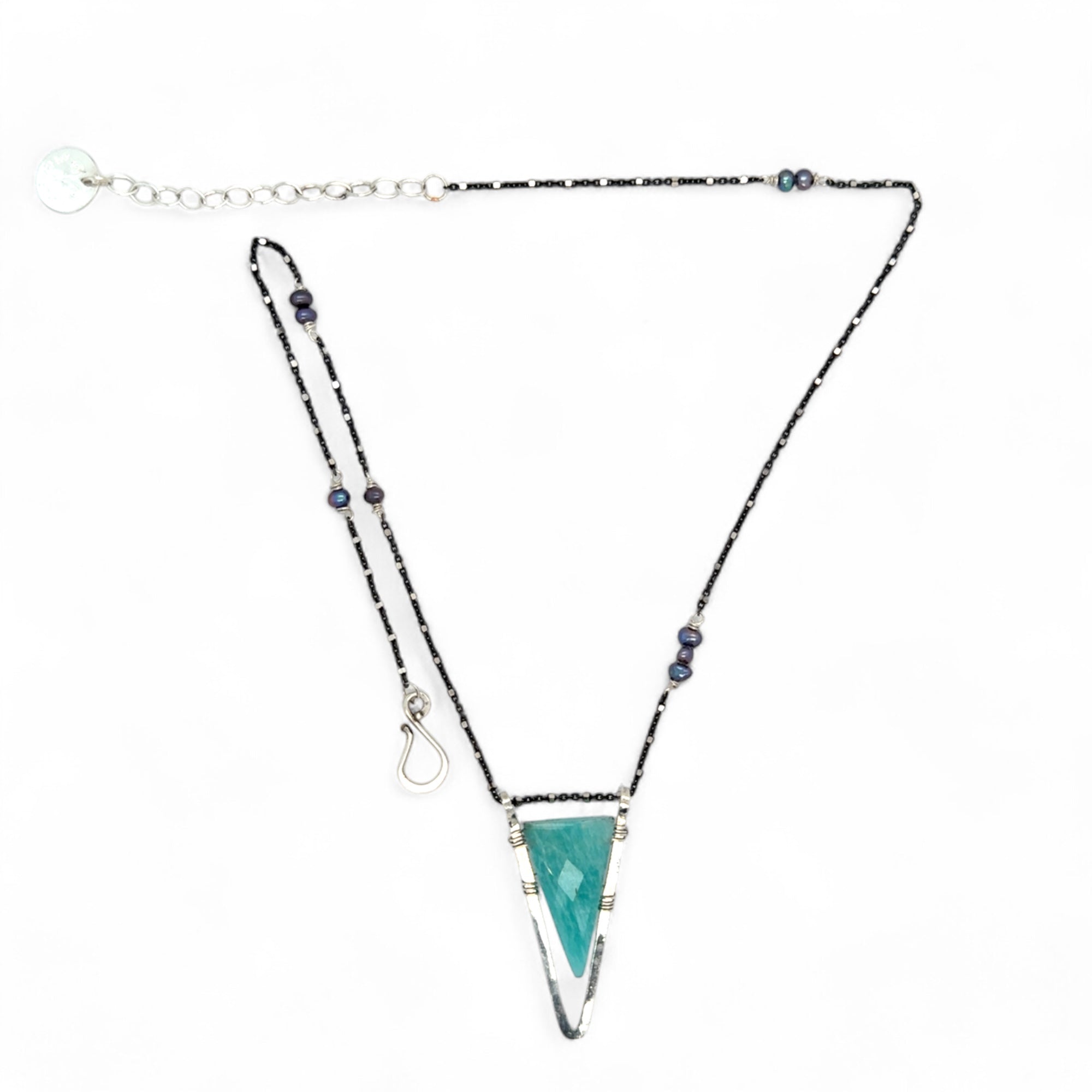 Amazonite faceted point inside a hammered sterling silver pointed pendant necklace on oxidized sterling dot chain with purple fresh water pearl accents