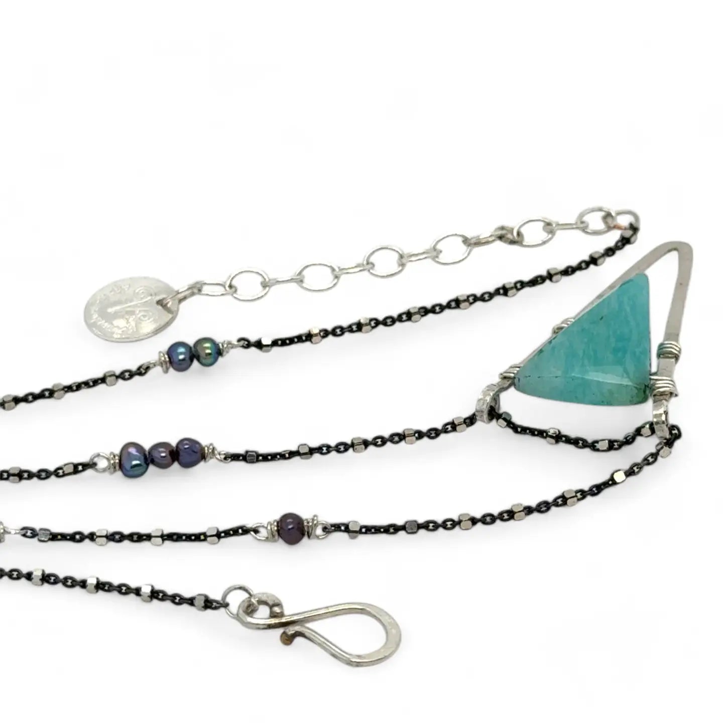 Amazonite faceted point inside a hammered sterling silver pointed pendant necklace on oxidized sterling dot chain with purple fresh water pearl accents