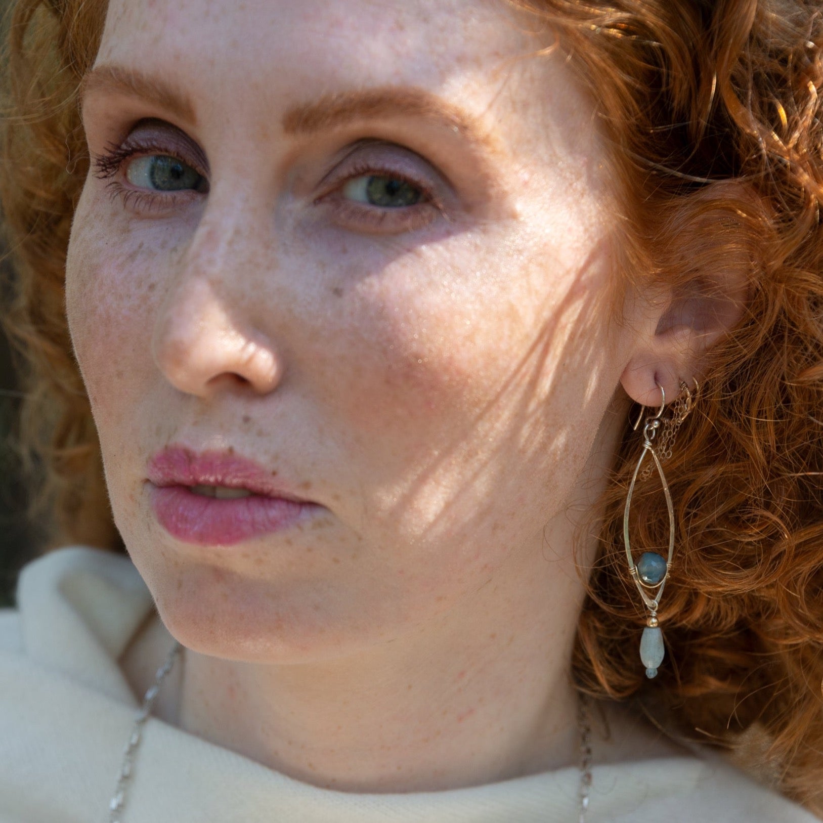 Sterling silver marquise shaped earrings with blue agate, amazonite, and apatite gemstones, featuring a disco ball design.