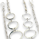 Handmade hammered large oval links held together with delicate sterling silver barrel tube chain to form long necklace that can be worn at any length