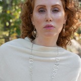 Handmade hammered large oval links held together with delicate sterling silver barrel tube chain to form long necklace that can be worn at any length