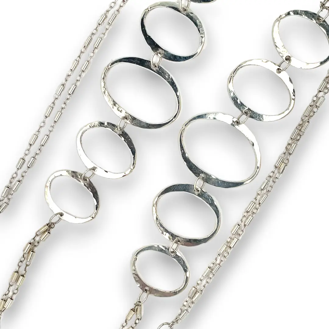 Handmade hammered large oval links held together with delicate sterling silver barrel tube chain to form long necklace that can be worn at any length