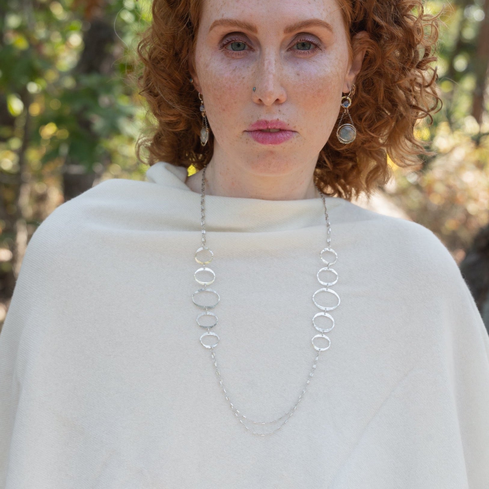 Handmade hammered large oval links held together with delicate sterling silver barrel tube chain to form long necklace that can be worn at any length