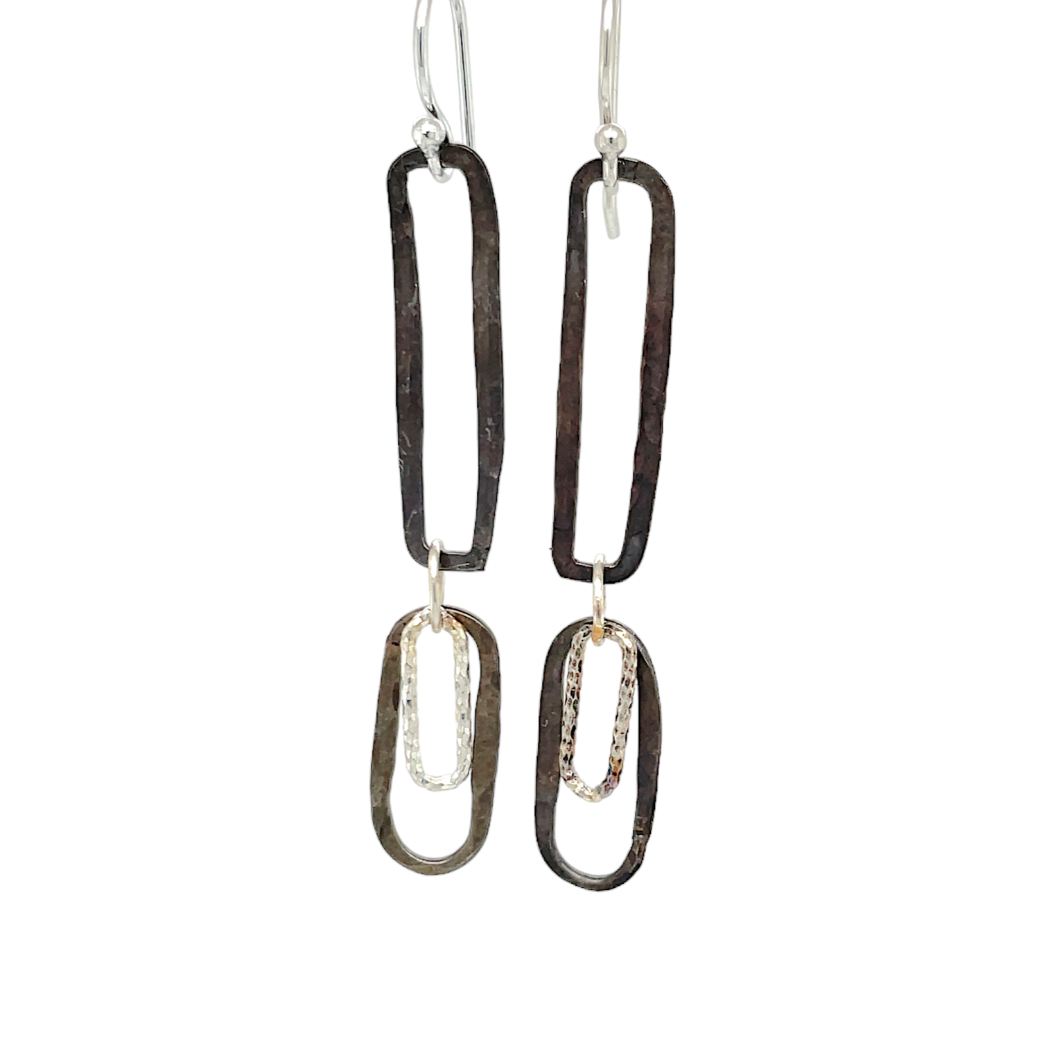 Oxidized sterling silver ovals and diamond cut links hang from oxidized hammered sterling silver rectangles 