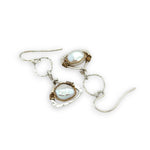 Tiny sterling silver hammered triangles hanging from a textured sterling silver ring with a fresh water pearl wrapped in twisted brass wire earrings