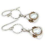 Tiny sterling silver hammered triangles hanging from a textured sterling silver ring with a fresh water pearl wrapped in twisted brass wire earrings