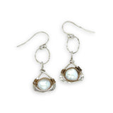 Tiny sterling silver hammered triangles hanging from a textured sterling silver ring with a fresh water pearl wrapped in twisted brass wire earrings