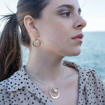 Handmade hammered brass mini hoops with fresh water pearls held in sterling silver and brass twist wires