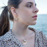 Handmade hammered brass mini hoops with fresh water pearls held in sterling silver and brass twist wires