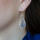 Mini bronze infinity earrings beaded with smooth iolite nuggets, moonstone and crystal on sterling silver wire