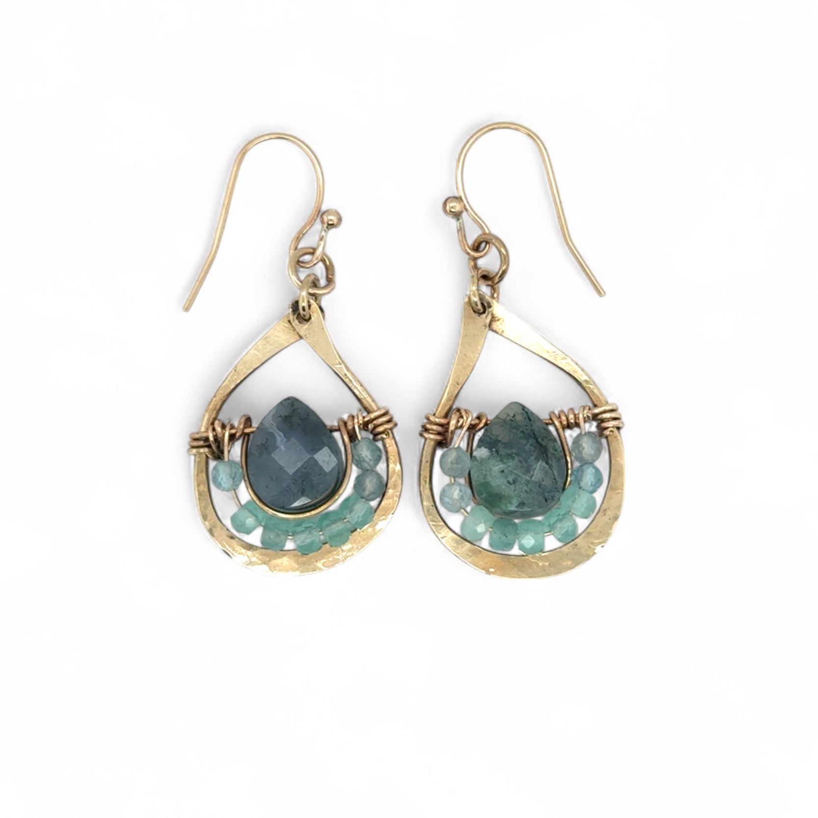 Gold earrings with green agate gemstones on a white background