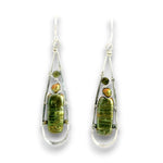 A pair of teardrop-shaped dangle earrings featuring green baroque gemstone inlays set in silver wire frames with small iridescent orange-green beads, shown against a plain white background.