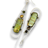 A pair of silver dangle earrings featuring iridescent green and gold baroque shell pieces, accented with small dark beads, on a white background.