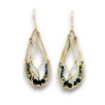 A pair of gold teardrop dangle earrings with intricate wire wrapping and small dark green faceted beads, shown on a plain white background.
