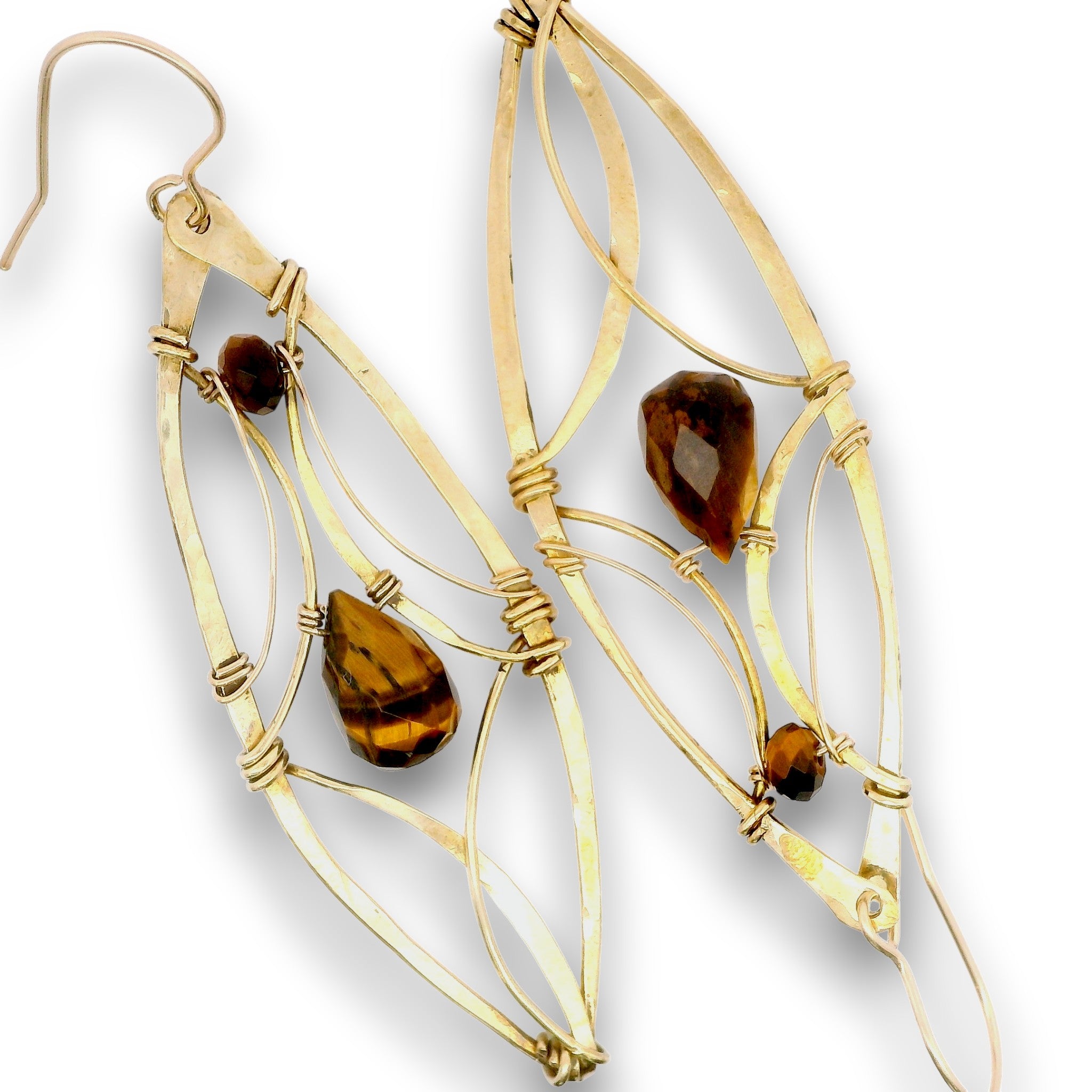 A pair of gold-toned dangle earrings with openwork wireframe leaf-like shapes, wrapped with small gold coils, and accented with faceted amber-brown teardrop and round stones, shown on a white background.