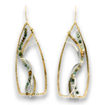 A pair of gold-tone dangle earrings with organic, open teardrop-shaped wire frames, featuring twisted clear fiber and small green, white, and brown bead strands, shown on a white background.