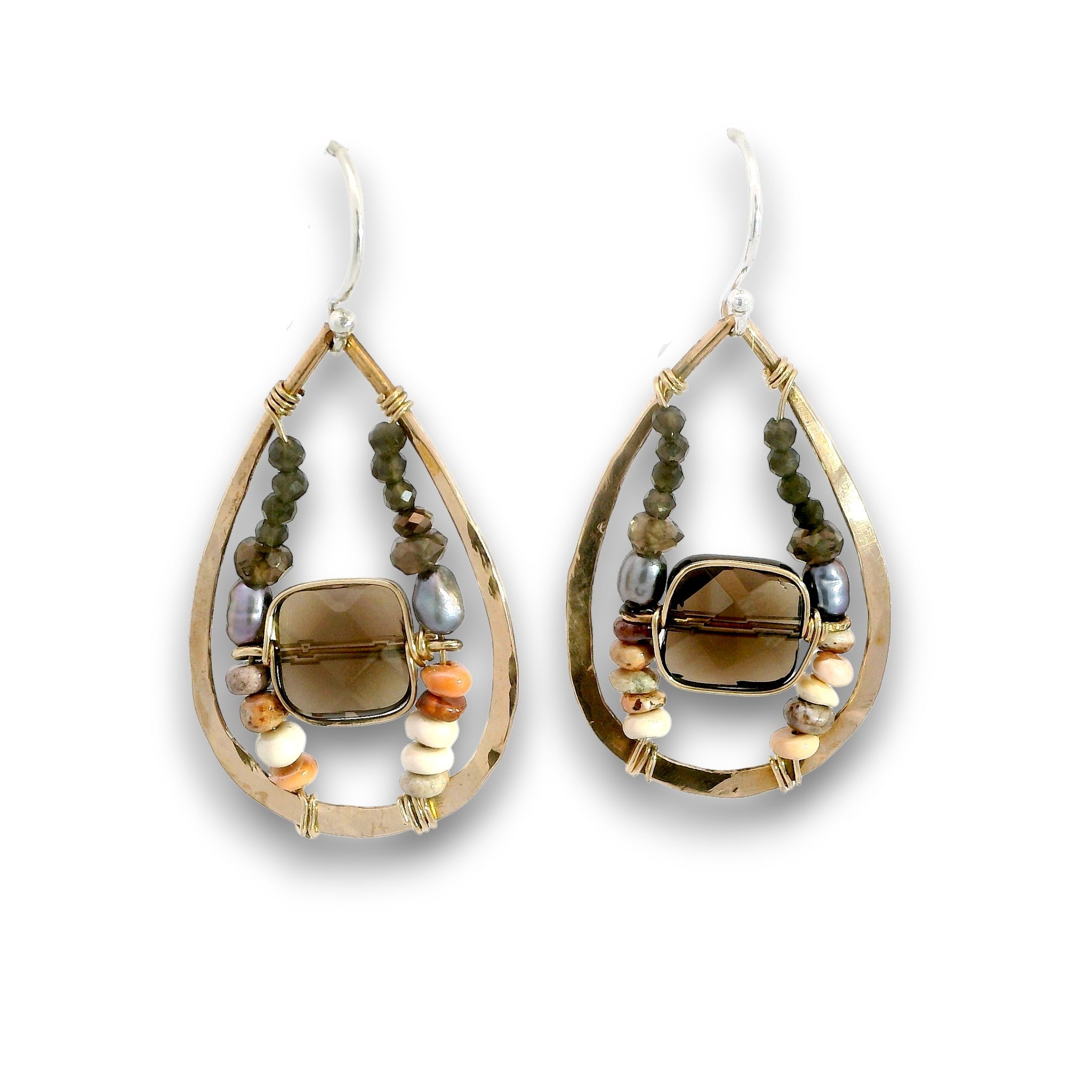 A pair of teardrop-shaped dangle earrings with a gold-tone frame, a central smoky brown stone, and dangling bead strands in green, white, and orange-brown on a white background.