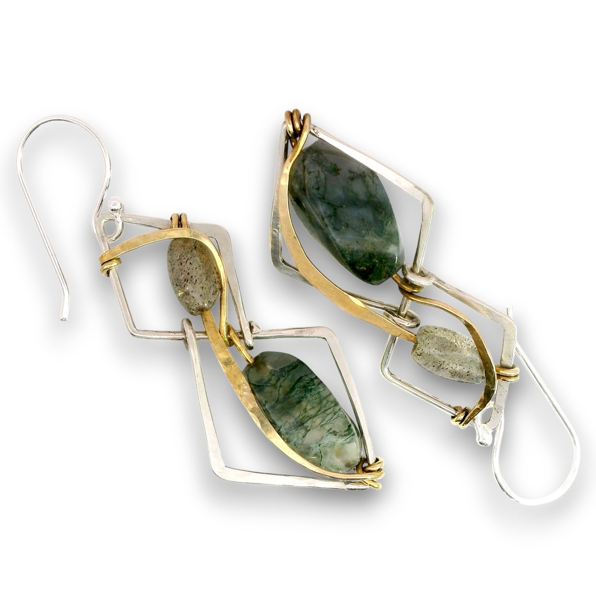 A pair of geometric drop earrings featuring polished green stone teardrop shapes and rough natural stone accents, set in a mix of yellow gold and silver-tone metal with fishhook backings, shown on a white background.