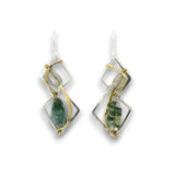 A pair of handmade dangle earrings featuring green agate stones set in a geometric design with gold and silver wire wrapping, shown on a plain white background.