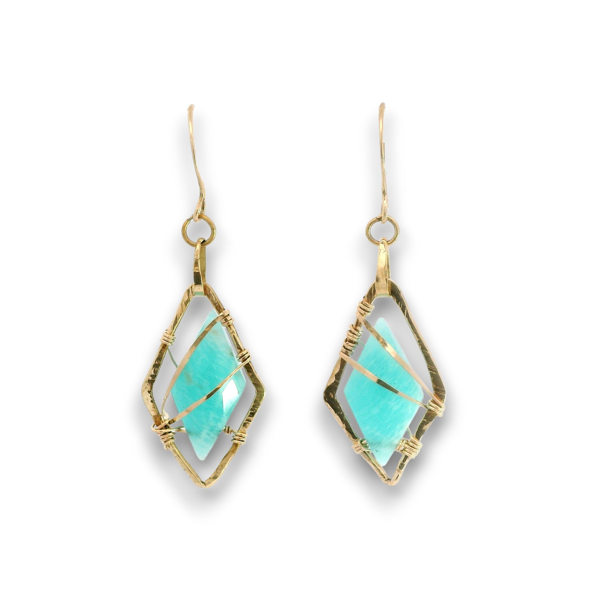 A pair of gold drop earrings featuring faceted light blue-green stones in a diamond-shaped bezel setting with textured gold wire wrapping, shown on a plain white background.