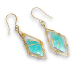 A pair of gold wire-wrapped drop earrings featuring natural light blue-green amazonite stones, displayed on a clean white background.