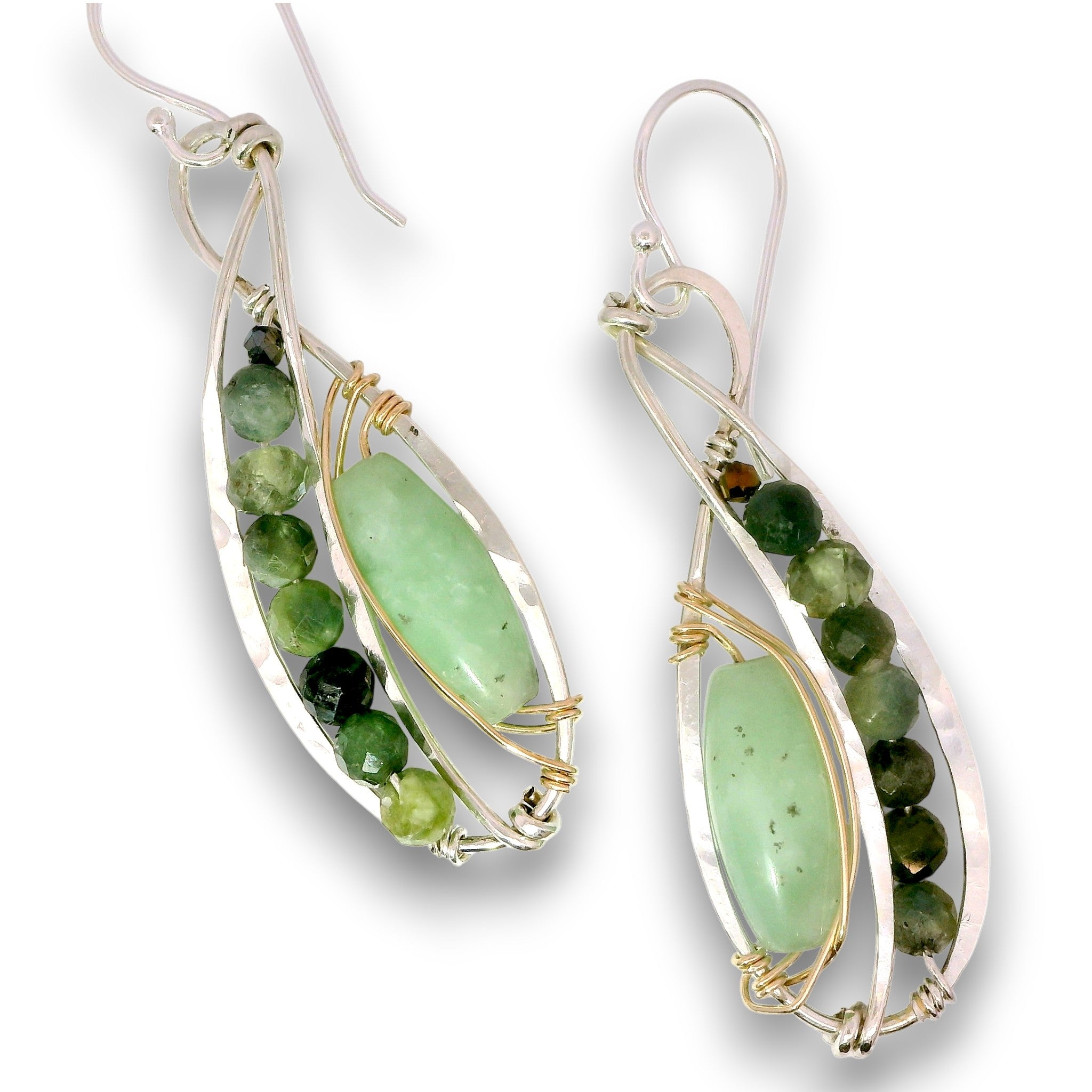 A pair of silver and gold wire-wrapped dangle earrings featuring oval-cut light green gemstone centers and a row of faceted green beads, shown on a white background.