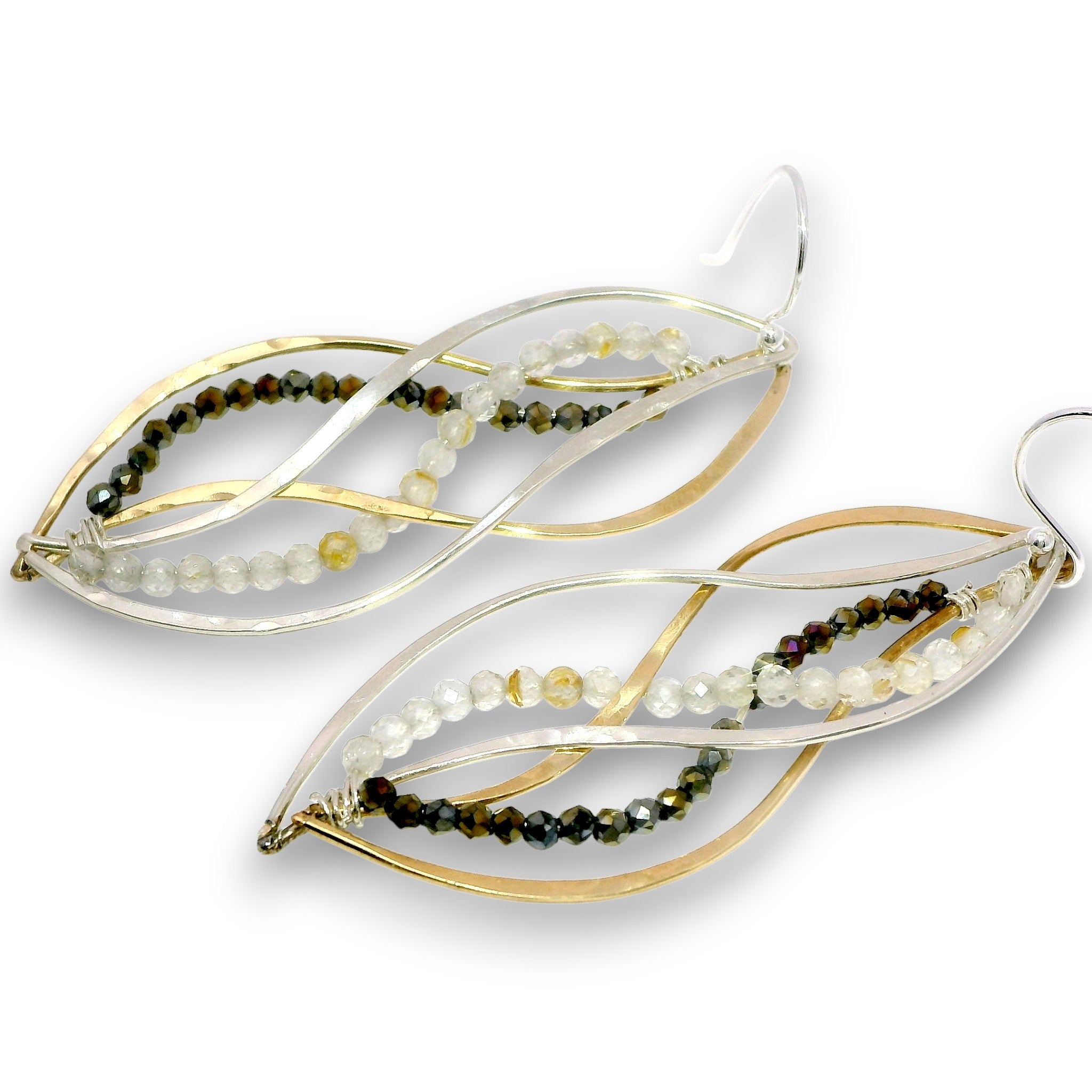 A pair of leaf-shaped dangle earrings featuring twisted gold and silver-tone metal wires, accented with strands of small faceted beads in olive green, dark brown, and milky white, shown on a plain white background.
