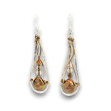 A pair of teardrop-shaped dangle earrings featuring iridescent baroque pearls, wrapped in twisted copper wire with small silver beads and silver hooks, shown on a white background.