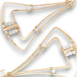 Gold-toned geometric wireframe earrings with small white bead accents, shown on a clean white background.