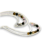 A pair of silver-toned double-strand earrings with small round beads in black, brown, pink, and white, arranged on a plain white background.