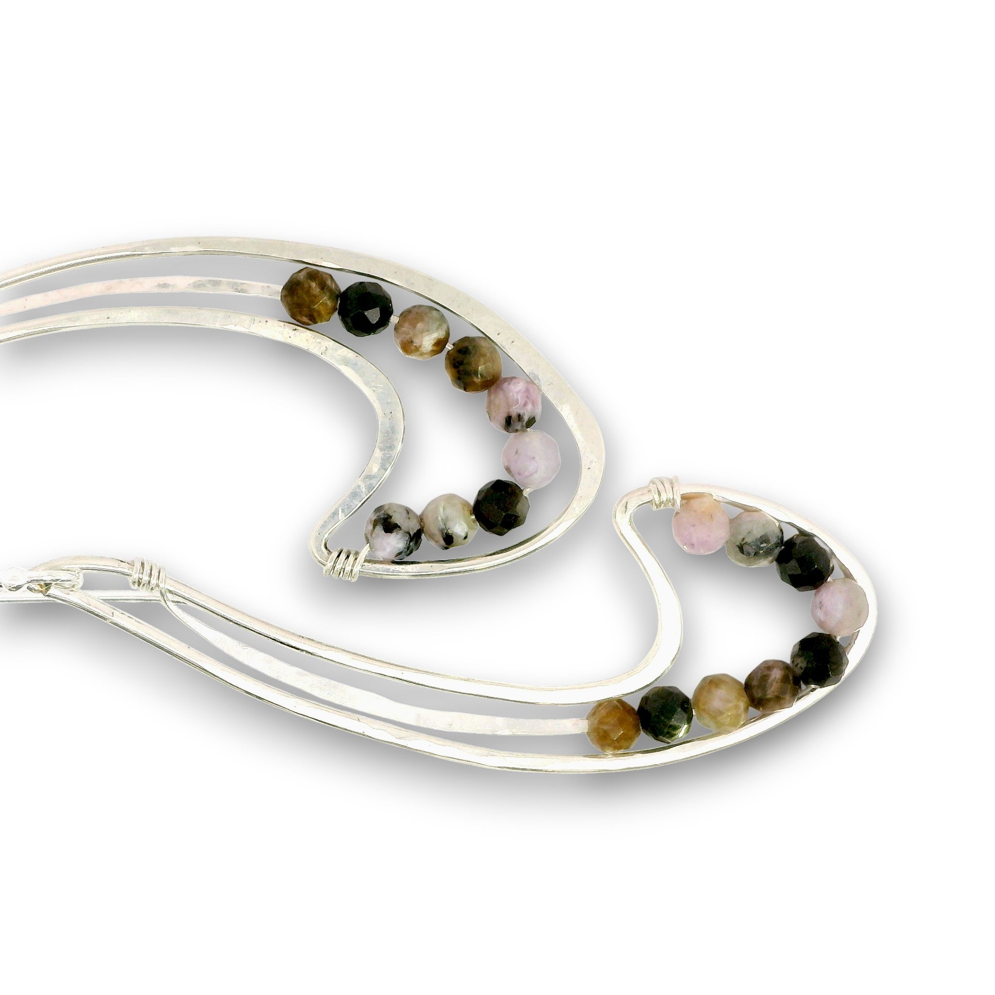 A pair of silver-toned double-strand earrings with small round beads in black, brown, pink, and white, arranged on a plain white background.