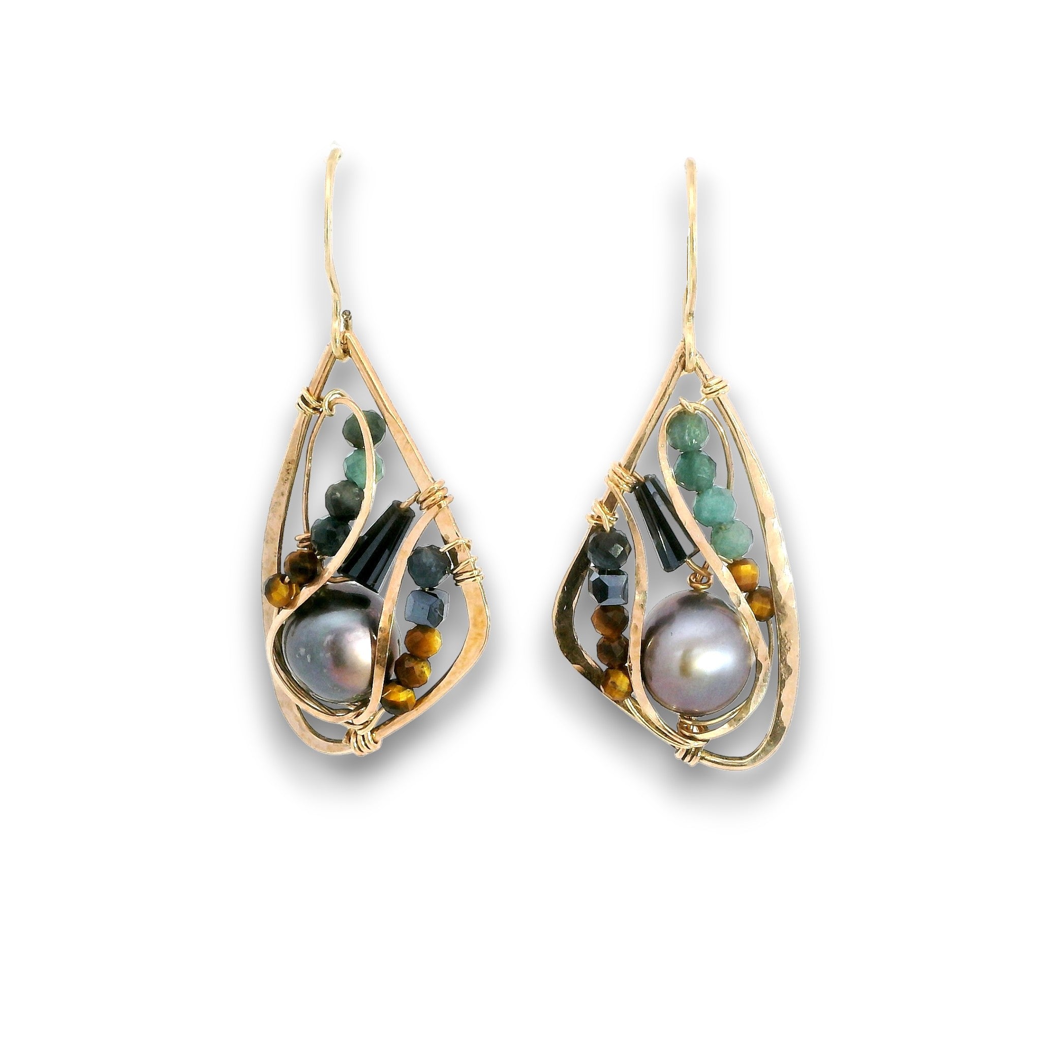 A pair of gold teardrop dangle earrings featuring a large iridescent pearl, green beads, and tiger's eye beads, set against a plain white background.
