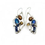 A pair of sterling silver mini diamond earrings featuring rust colored fresh water pearls, golden crystals, blue crystal drops, and lapis gemstones