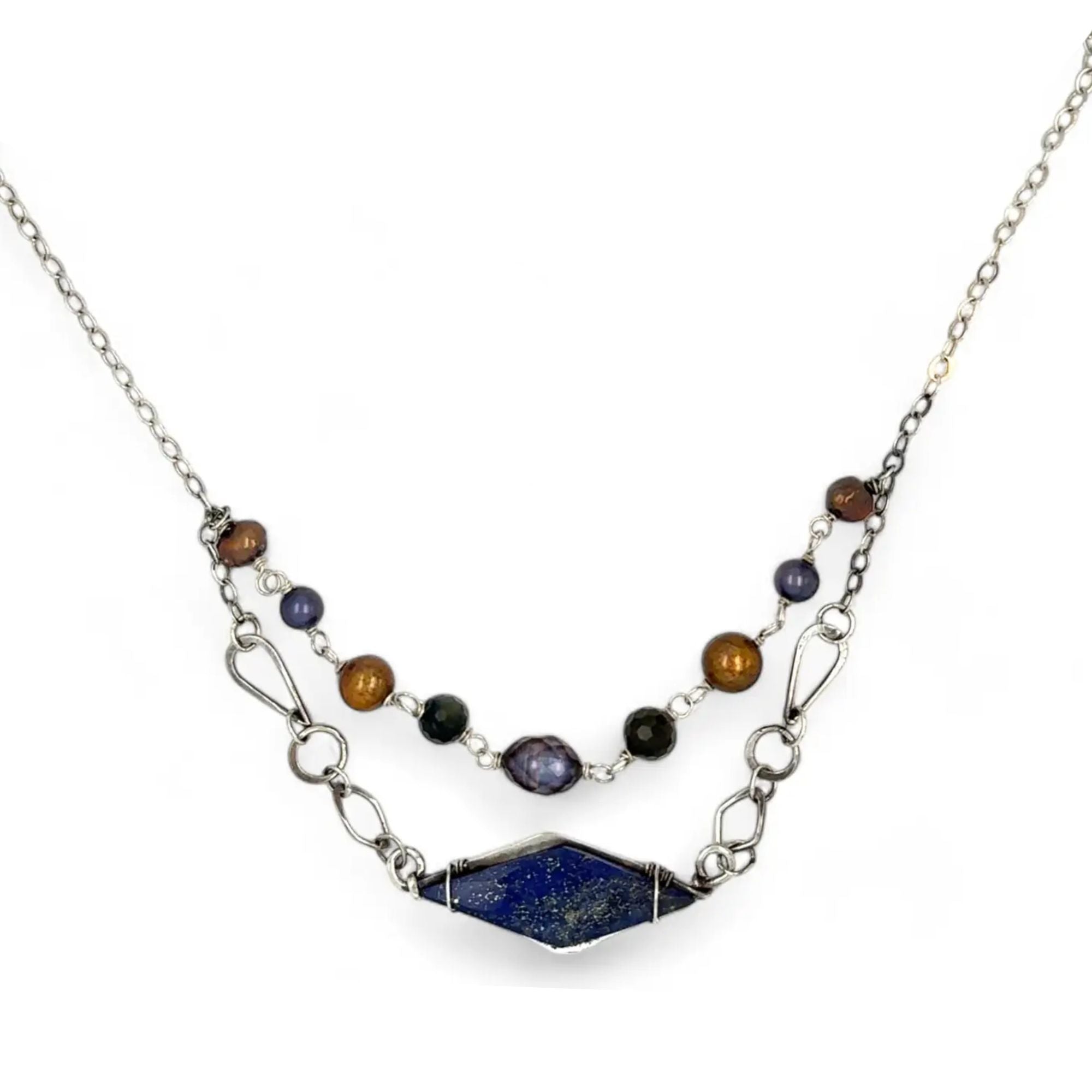 A diamond lapis gemstone is bezel set into sterling silver with handmade hammered link chain with rust and purple colored fresh water pearls necklace
