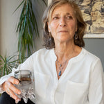 A sterling silver necklace with a handmade prong pendant featuring a deep blue sodalite natural gemstone, micro faceted sodalite and labradorite gemstones, and a lustrous gray blue fresh water pearl, connected to an oxidized link chain.