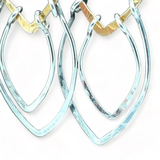 Sterling silver double teardrops swinging from stamped brass diamonds, all hanging from a braided brass link