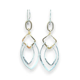 Sterling silver double teardrops swinging from stamped brass diamonds, all hanging from a braided brass link