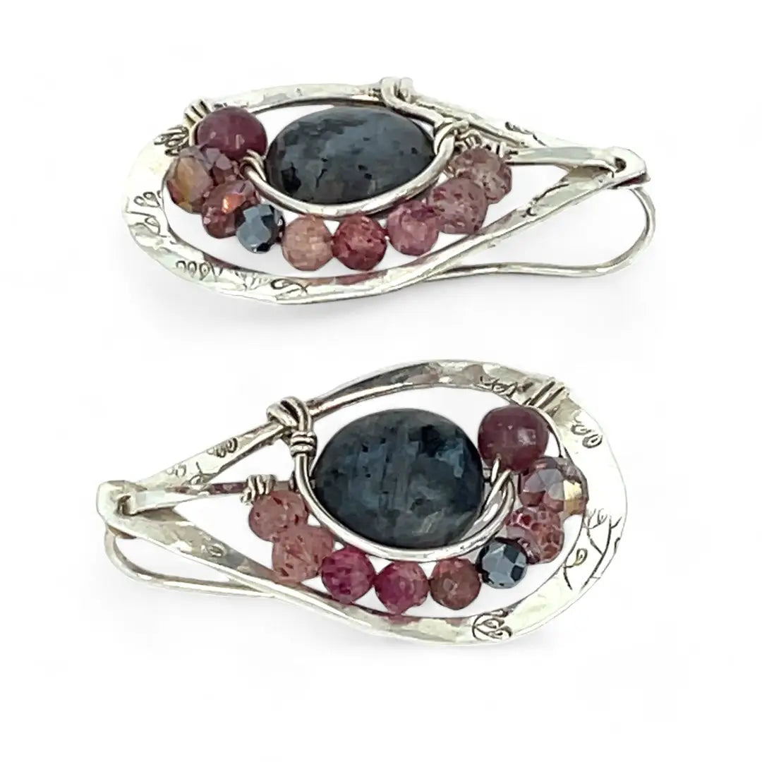 Floral stamped sterling silver drop earrings with larvikite smooth coins surrounded by pink tourmaline, lepidolite, and pyrite gemstones, with a built in earring hook that wears like a post earring