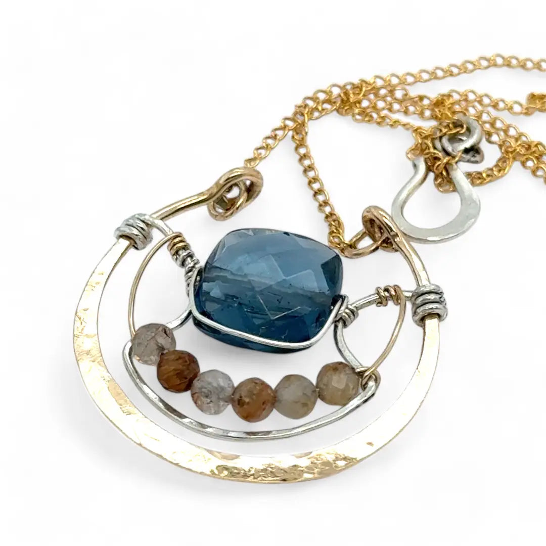 bronze circular pendant with sterling silver accents, london blue quartz square and rutilated quartz gemstones on gold filled chain necklace