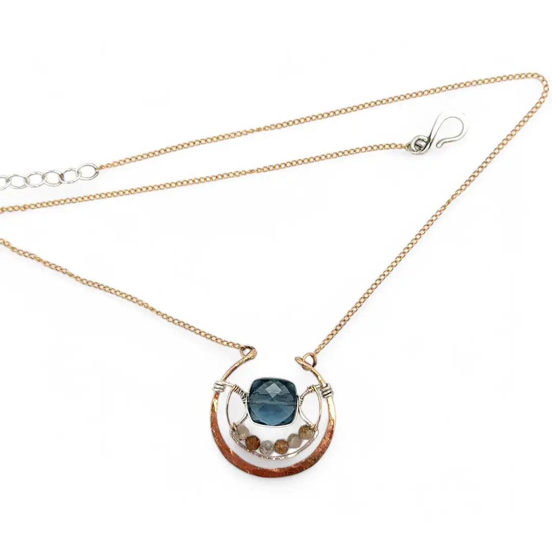 bronze circular pendant with sterling silver accents, london blue quartz square and rutilated quartz gemstones on gold filled chain necklace