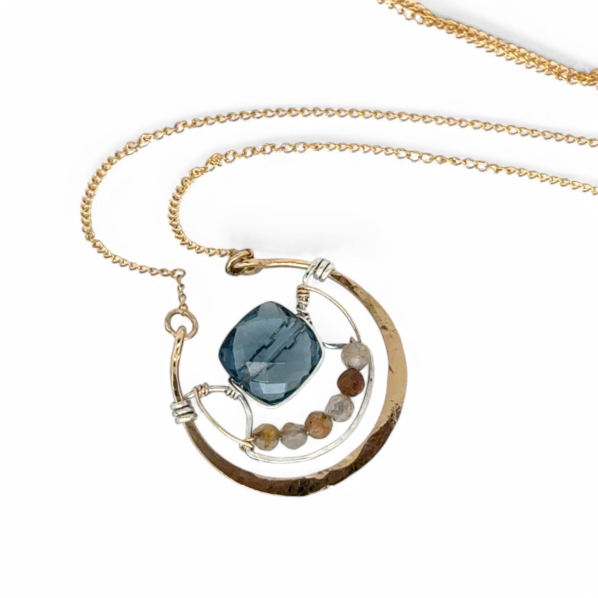 bronze circular pendant with sterling silver accents, london blue quartz square and rutilated quartz gemstones on gold filled chain necklace