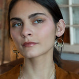 hammered bronze hoop earrings embroidered with a lemon quartz nugget, fresh water pearls, sparkly crystal, and cat's eye gemstones