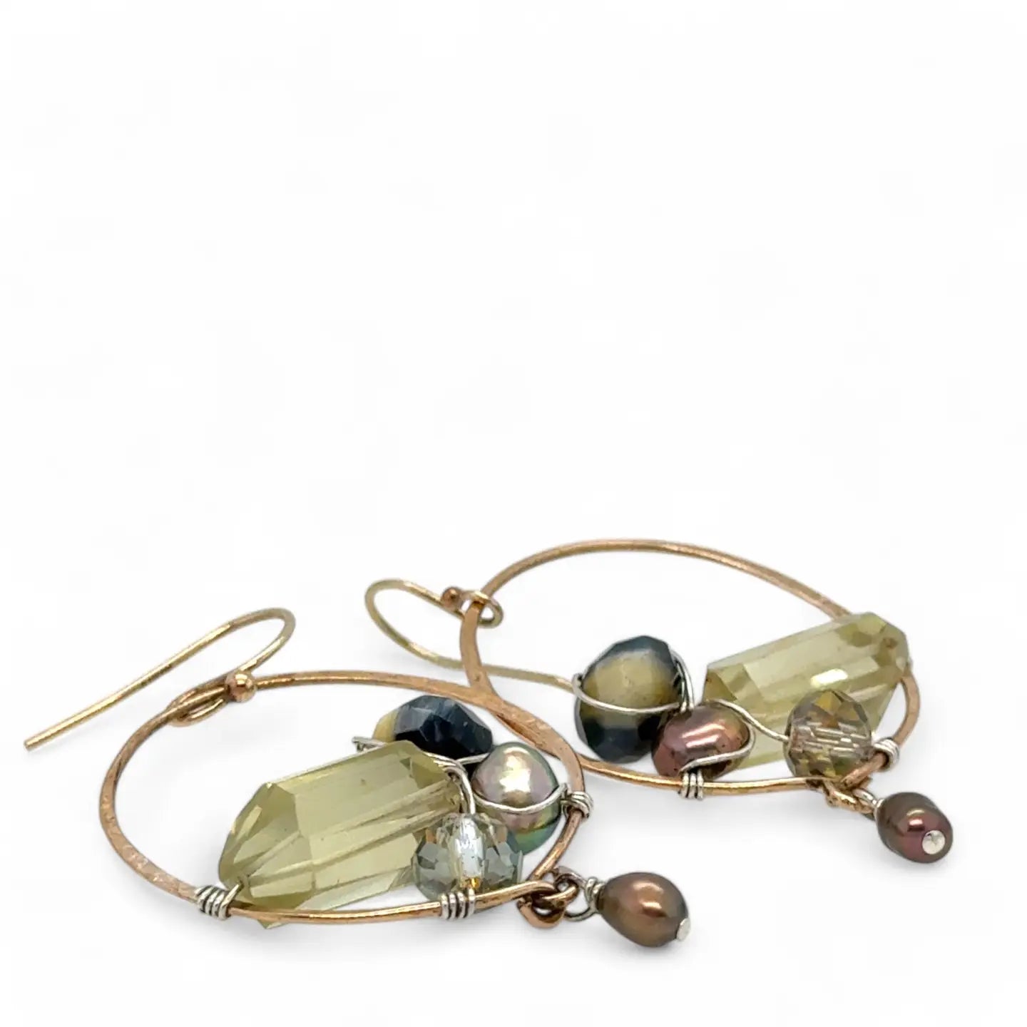 hammered bronze hoop earrings embroidered with a lemon quartz nugget, fresh water pearls, sparkly crystal, and cat's eye gemstones