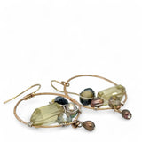 hammered bronze hoop earrings embroidered with a lemon quartz nugget, fresh water pearls, sparkly crystal, and cat's eye gemstones