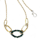 A gold-filled crinkle chain holding handmade brass links and an emerald ring  necklace