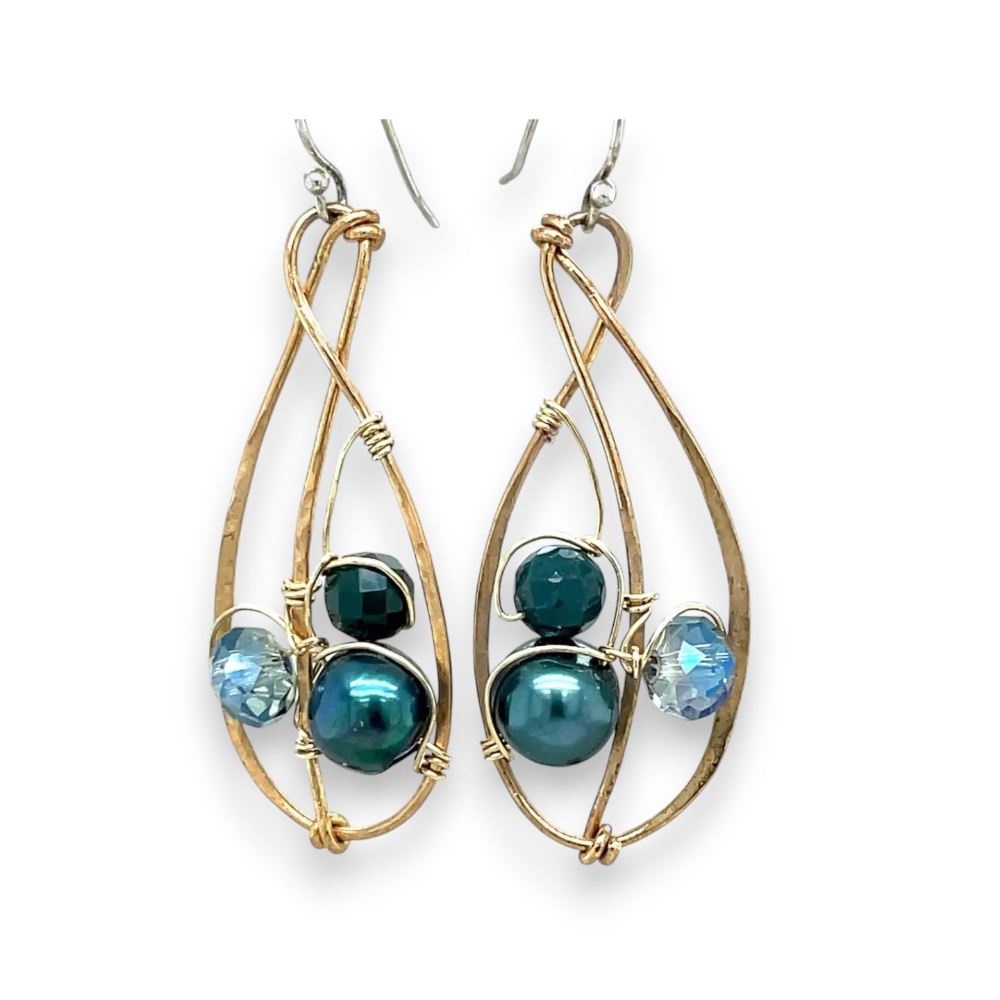 Green pearl, faceted bloodstone gemstone, and blue green crystal are nestled within brass infinity earrings on gold filled wire