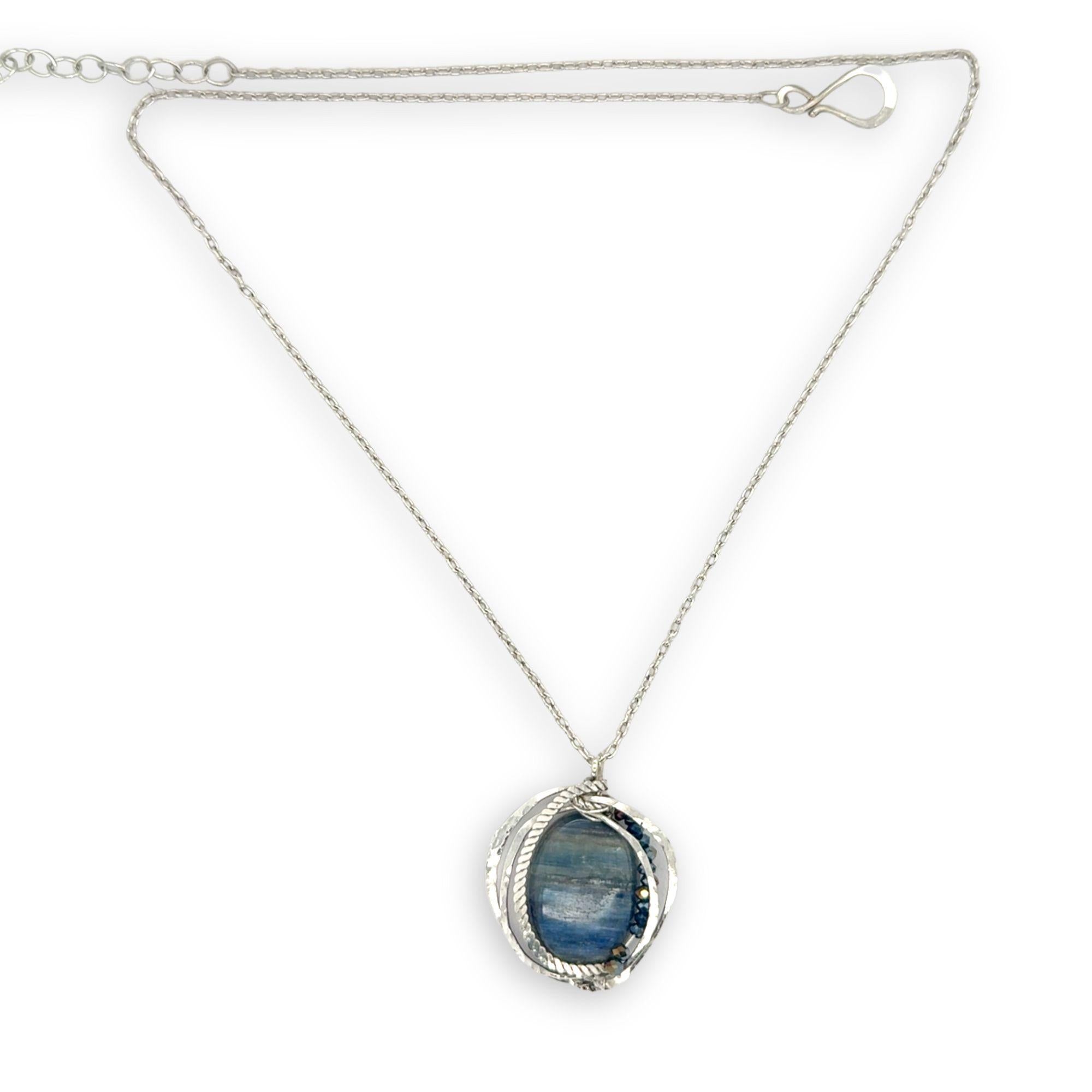 Large smooth oval kyanite gemstones encircled in hammered sterling silver and blue crystal gemstone necklace